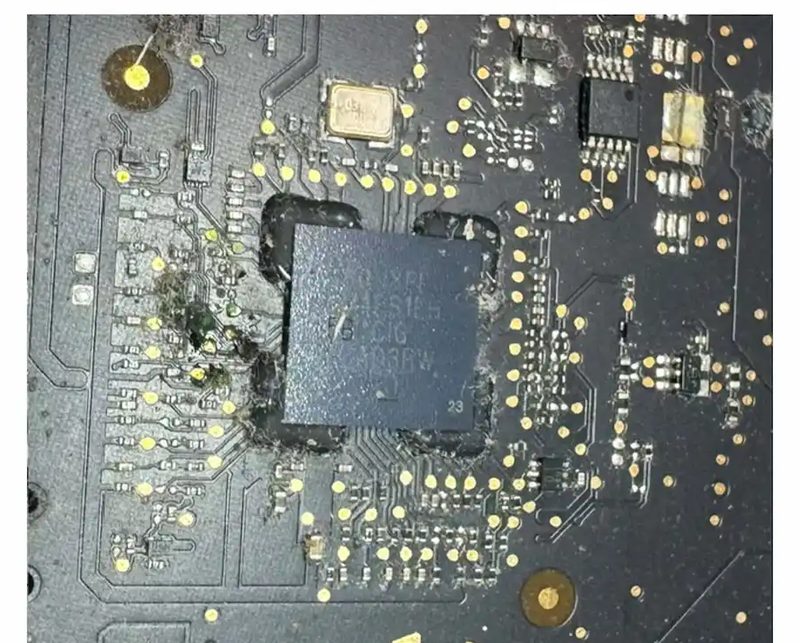 Close-up of a component-level chip repair on a MacBook logic board at eRepair Chicago