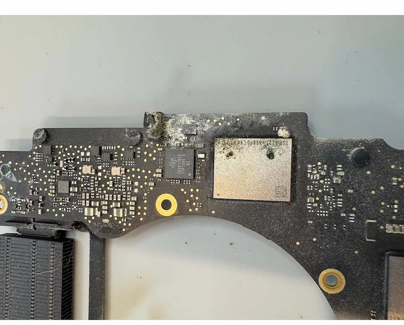 A liquid-damaged MacBook board cleaned and recovered at eRepair Chicago