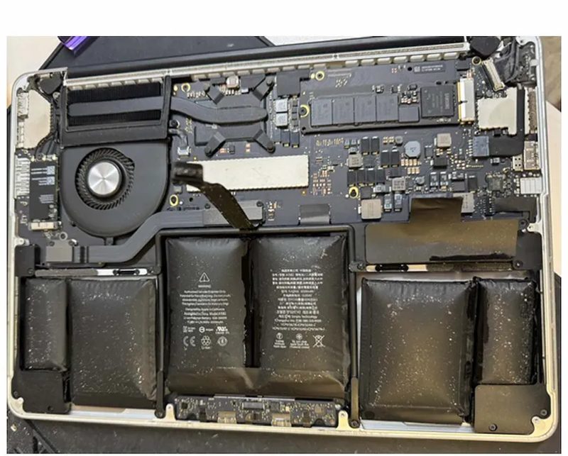 Swollen MacBook battery being replaced at eRepair Chicago